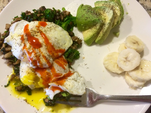 A delicious breakfast recipe: sautéed veggie medley, fried eggs, avocado, and banana